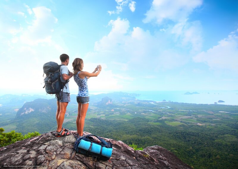 Couple hiking at mountain peak