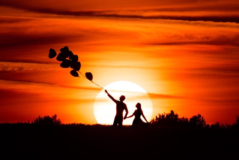 Couple Holding Balloons — Orange