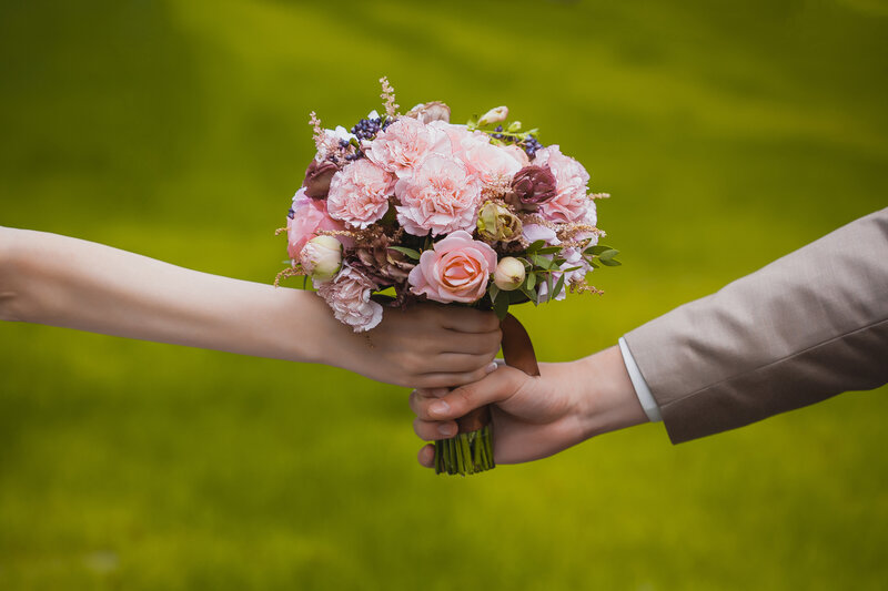 Couple Holding Bouquet