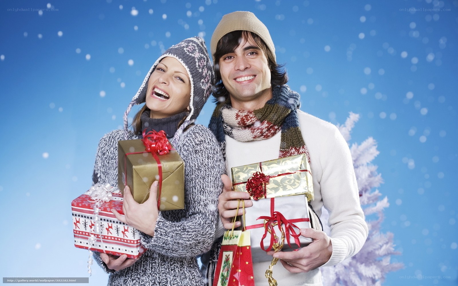 Couple holding Christmas gifts