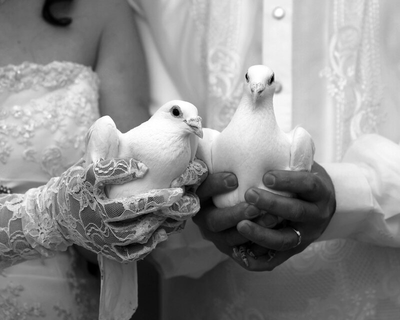 Couple Holding Doves