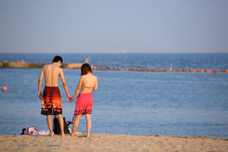 Couple holding hands at beach