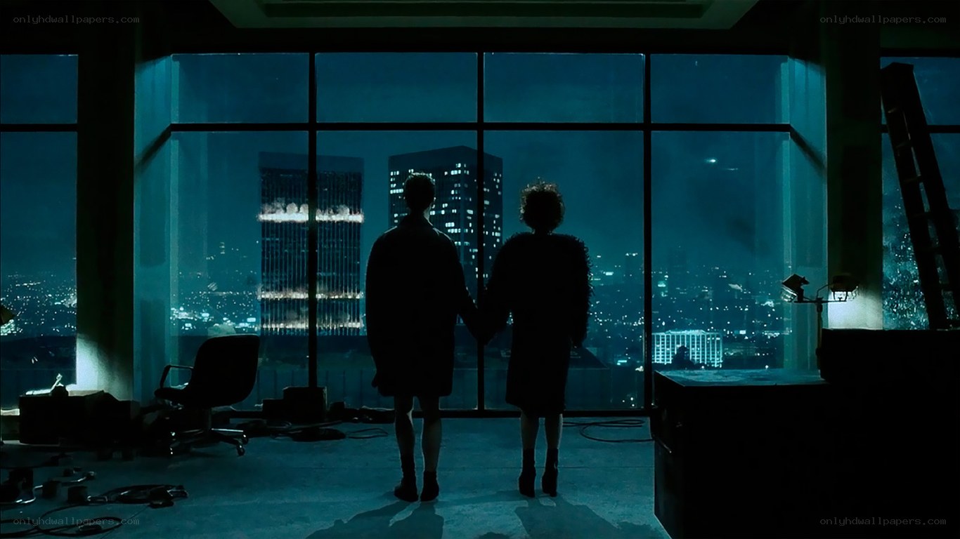 couple holding hands at night