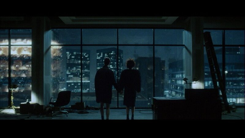 couple holding hands at night