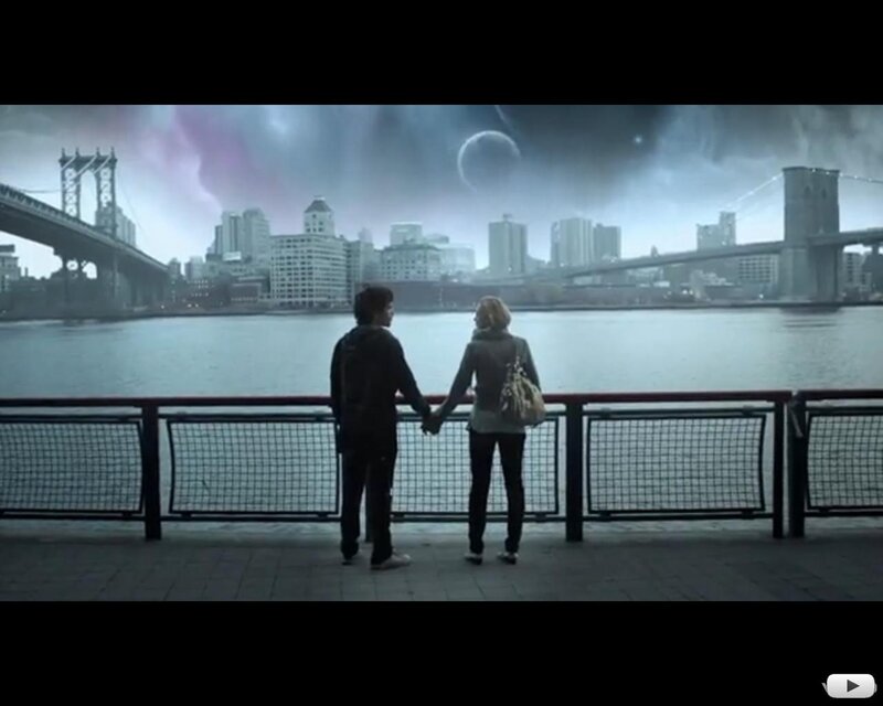 couple holding hands by river