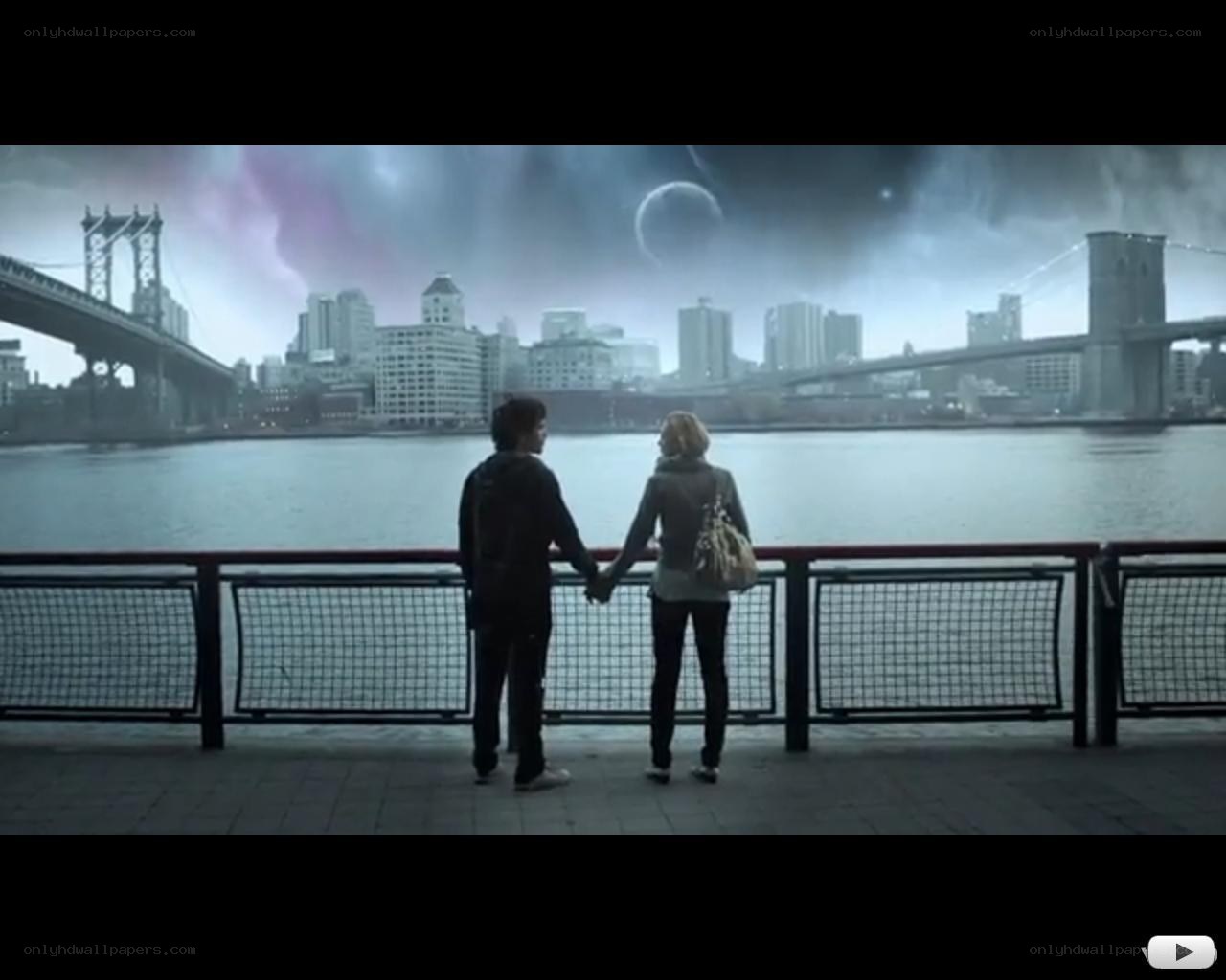 couple holding hands by river
