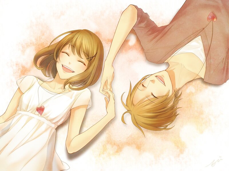 Couple holding hands lying down