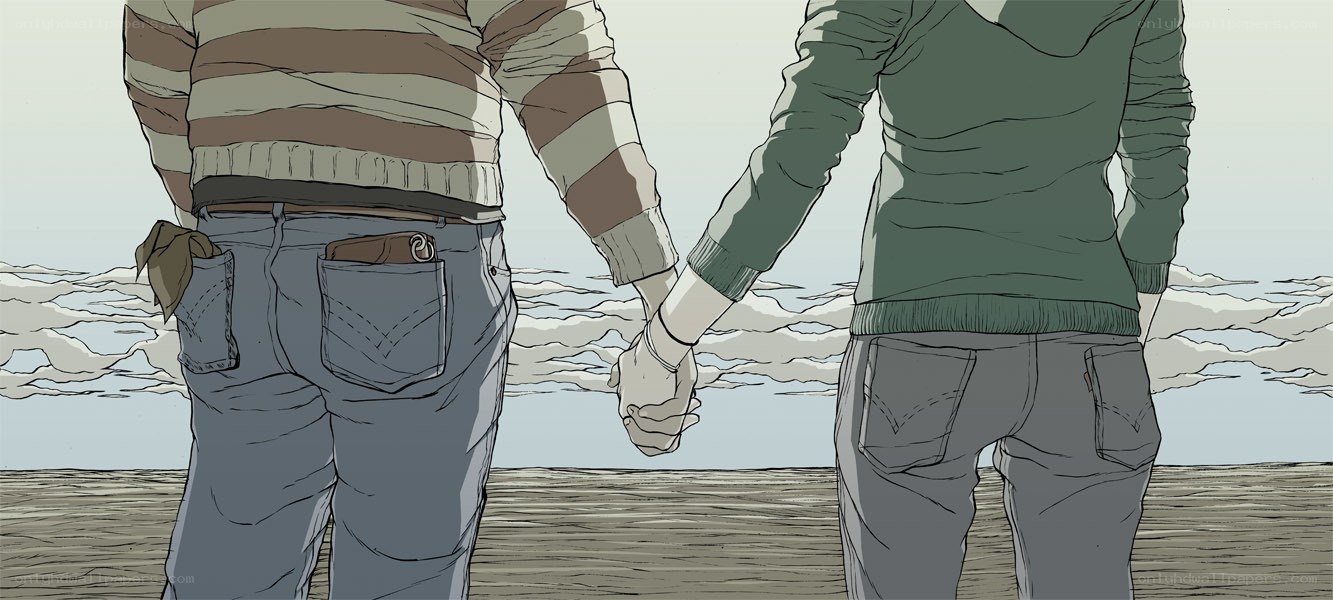 couple holding hands on beach