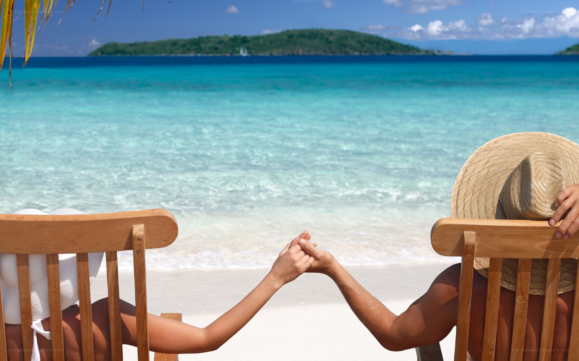 Couple holding hands on beach
