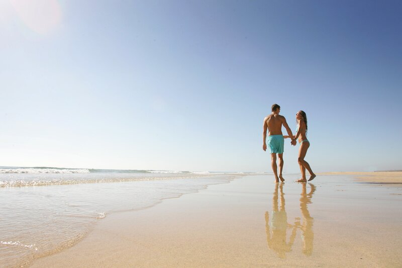 Couple Holding Hands on Beach — Blue, Serene