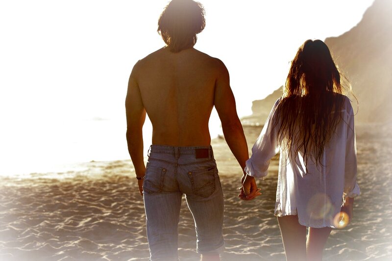 Couple Holding Hands on Beach — White