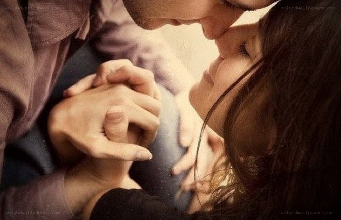 couple holding hands tenderly