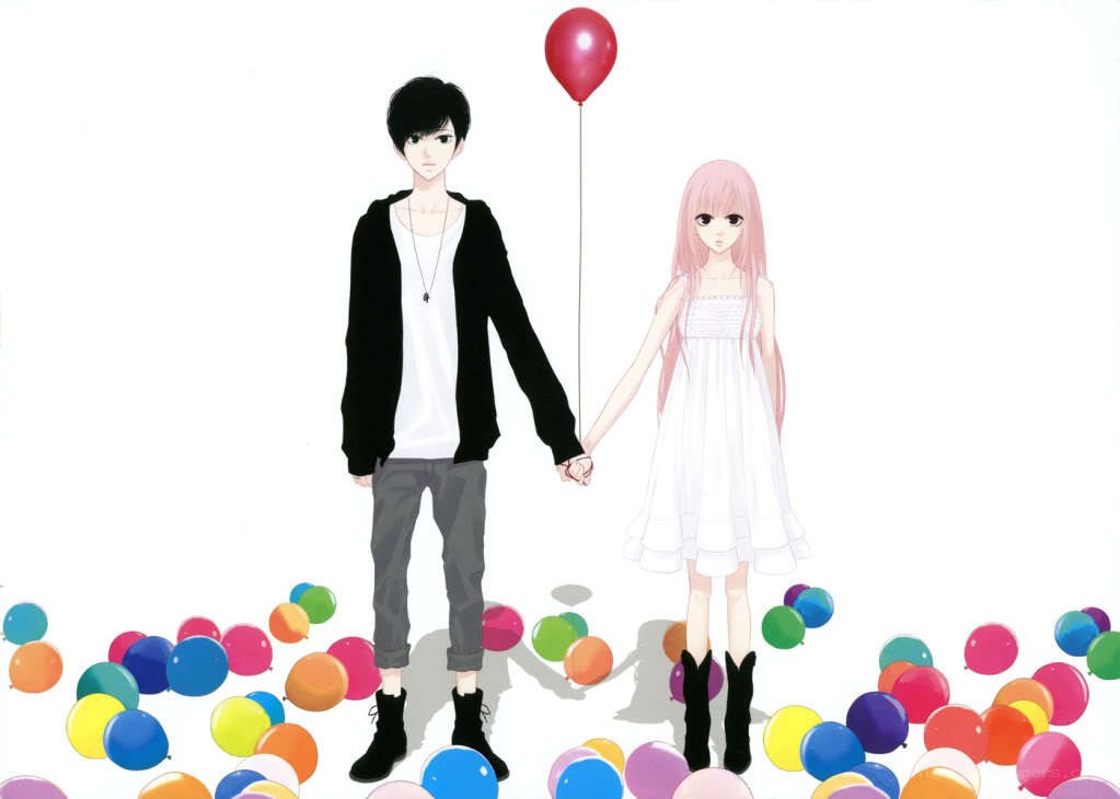 couple holding hands with balloons