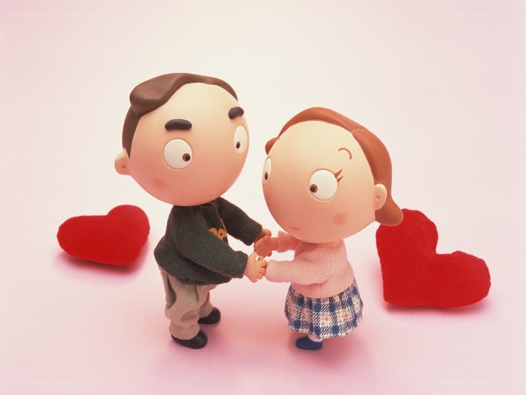couple holding hands with hearts