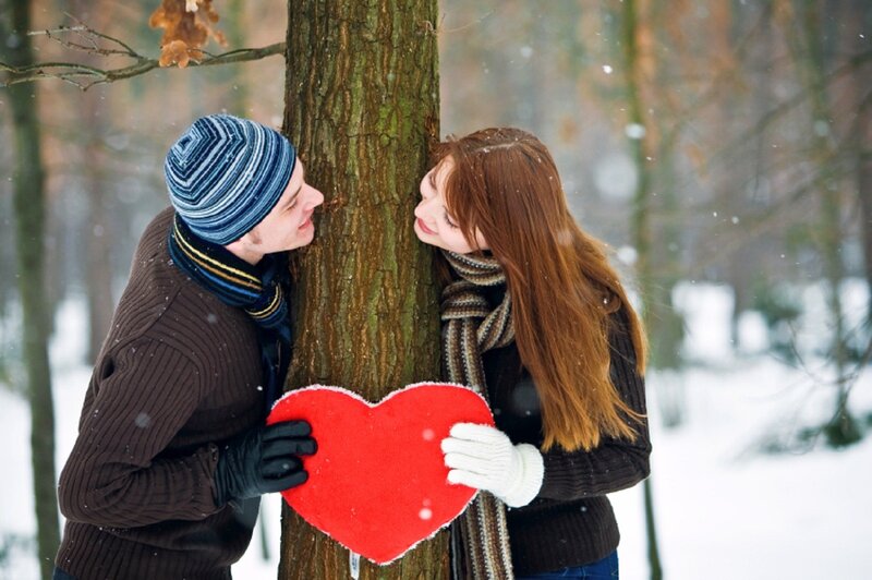 Couple Holding Heart