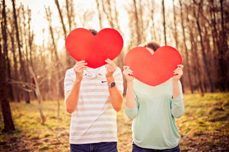 Couple Holding Hearts — Red