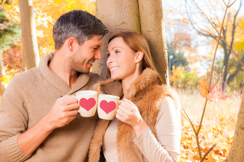 Couple Holding Mugs — Brown