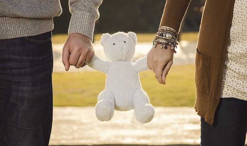 Couple Holding Teddy Bear