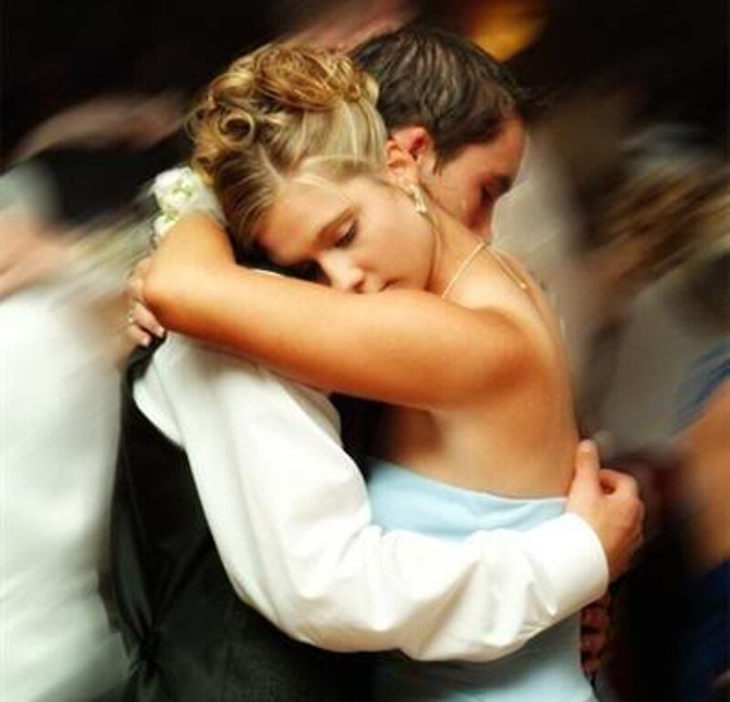Couple Hugging at Event — White