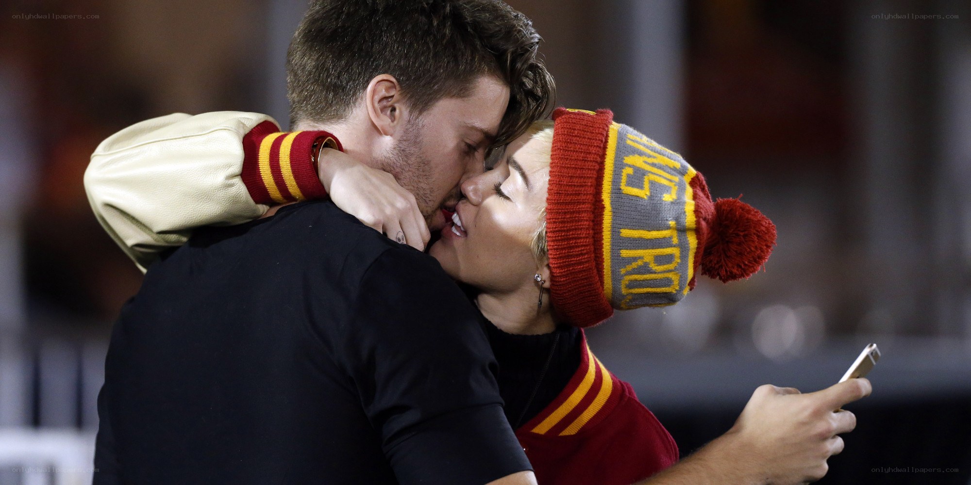 Couple hugging at night