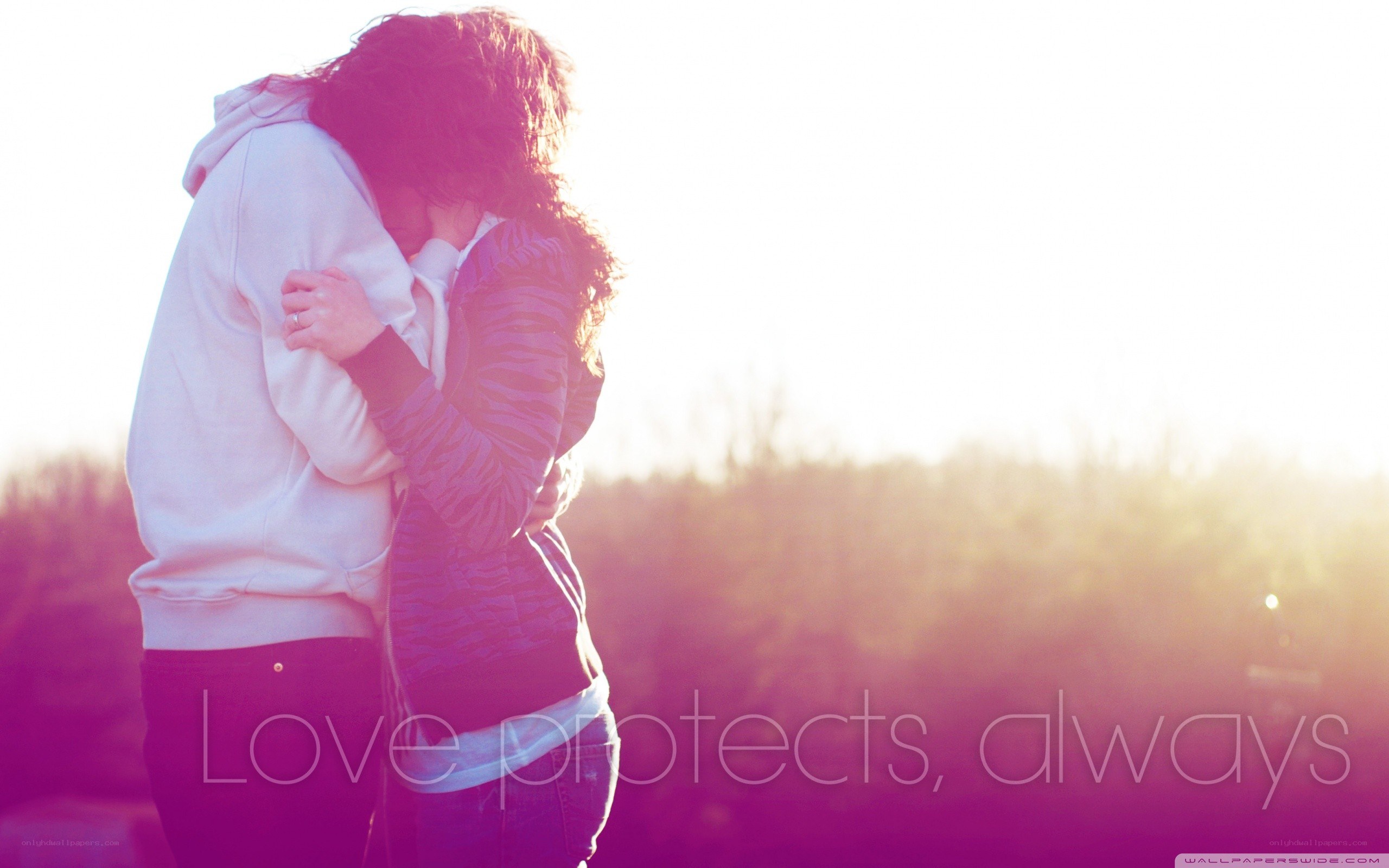 couple hugging at sunset