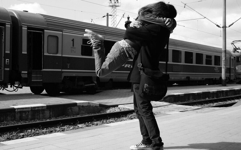 Couple Hugging at Train Station — Black, Dramatic, Afternoon, Photograph, Platform