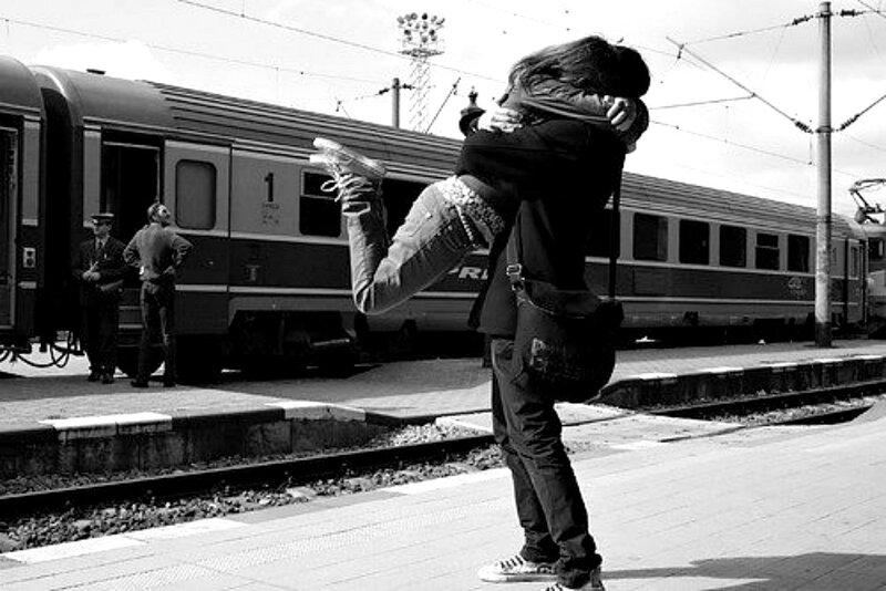 Couple Hugging at Train Station — Black, Dramatic, Afternoon, Photograph