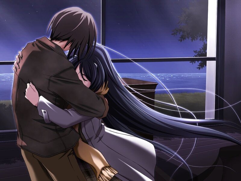couple hugging by the window