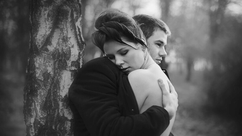 Couple Hugging by Tree — Black, Somber