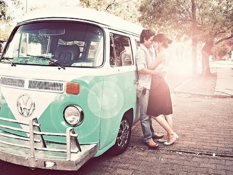 Couple Hugging by Van