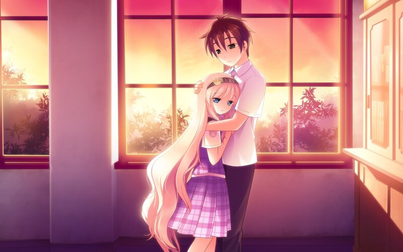 couple hugging by window