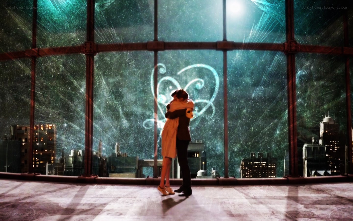 couple hugging by window