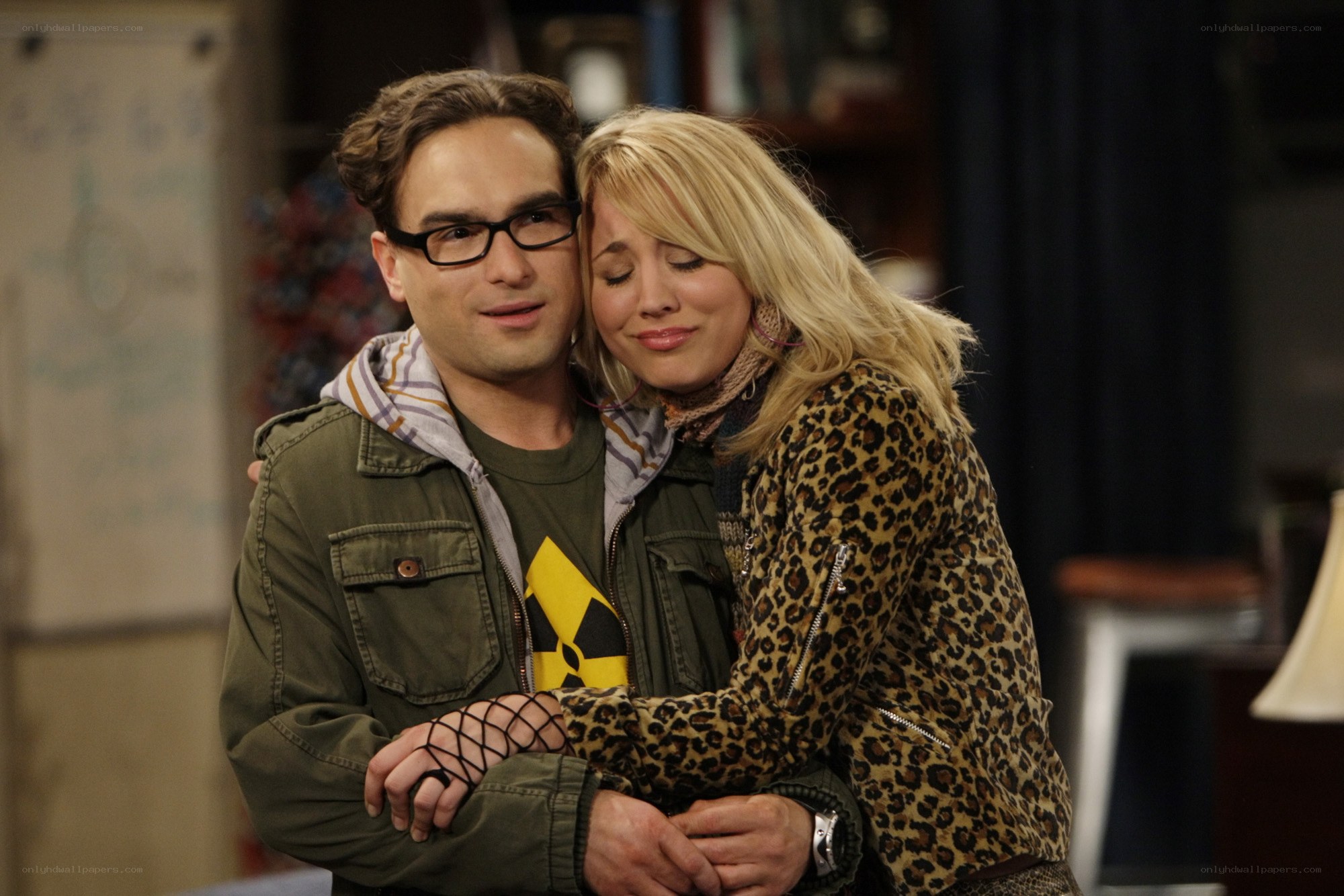 Couple hugging in a room