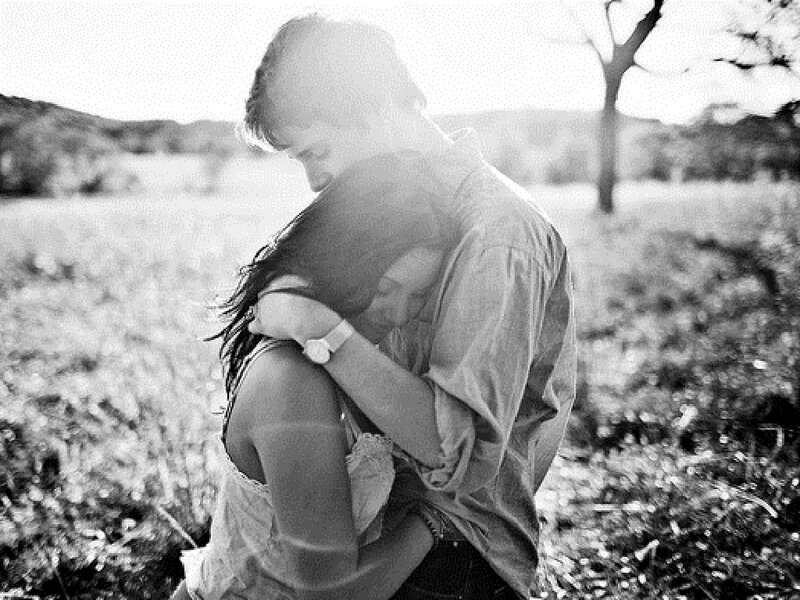 Couple Hugging in Field — Black, Intimate
