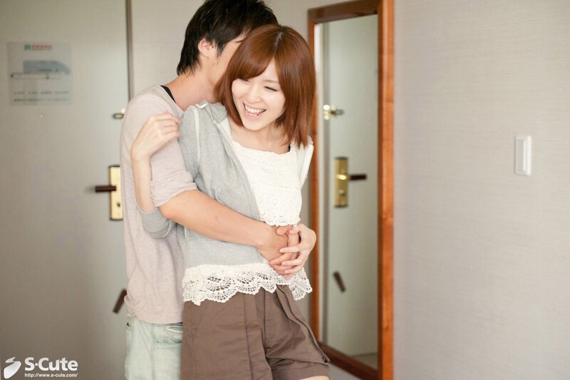Couple hugging in hallway