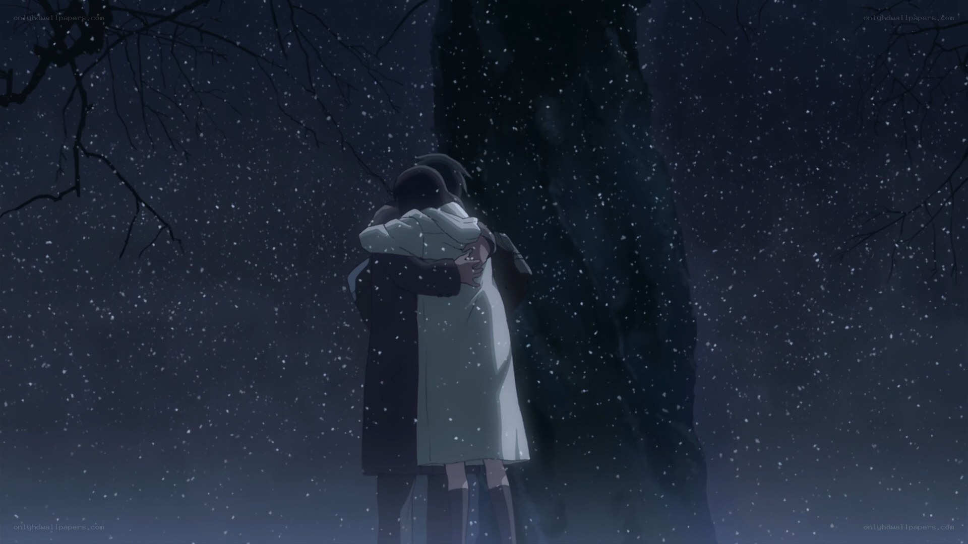 couple hugging in snow