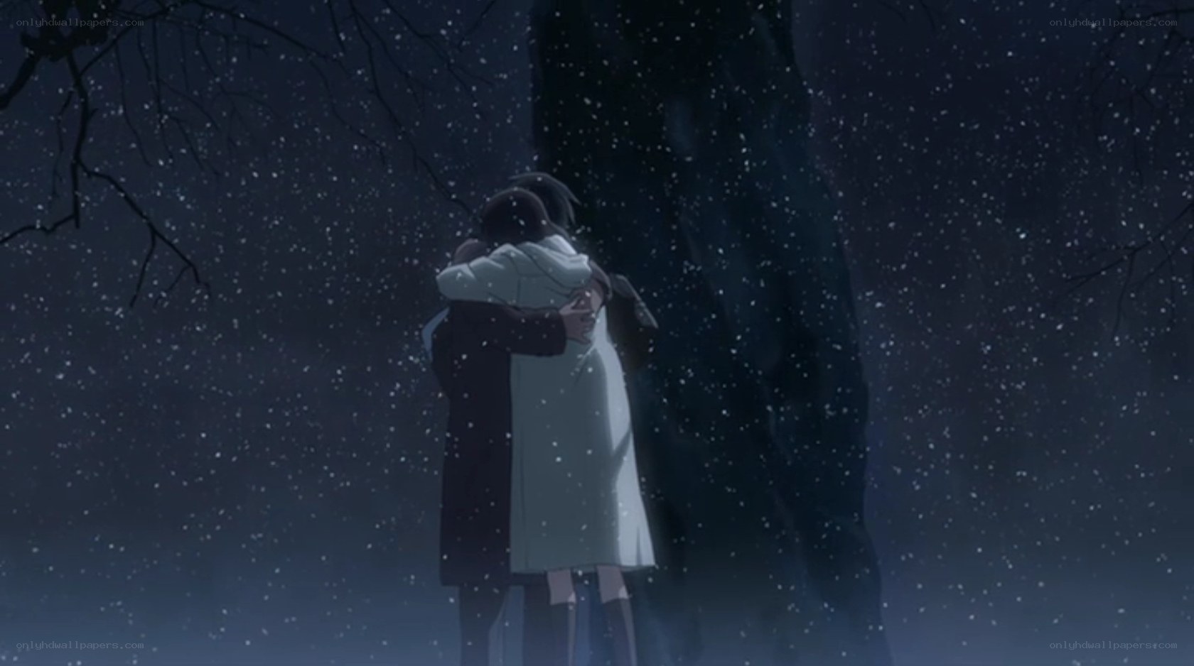 couple hugging in snow