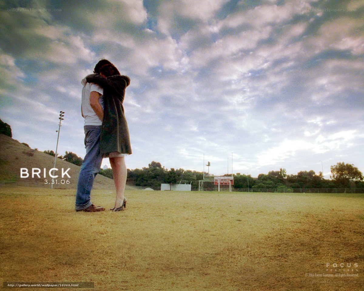 Couple hugging on a field