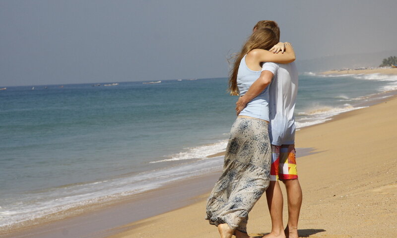 Couple Hugging on Beach — Blue, Serene, Afternoon