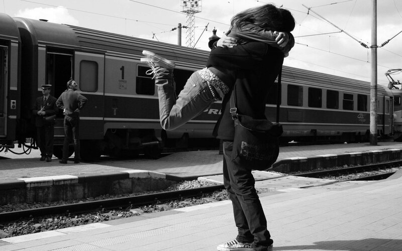 Couple Hugging on Platform — Black, Dramatic