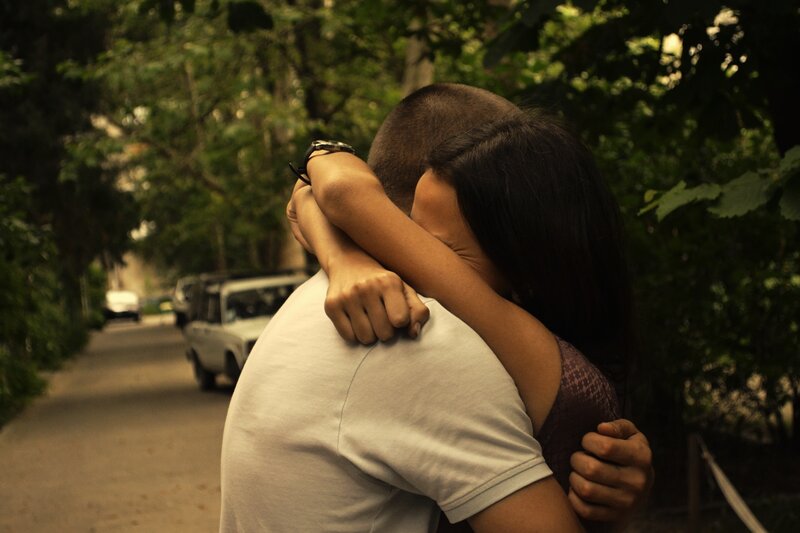 Couple Hugging on Street