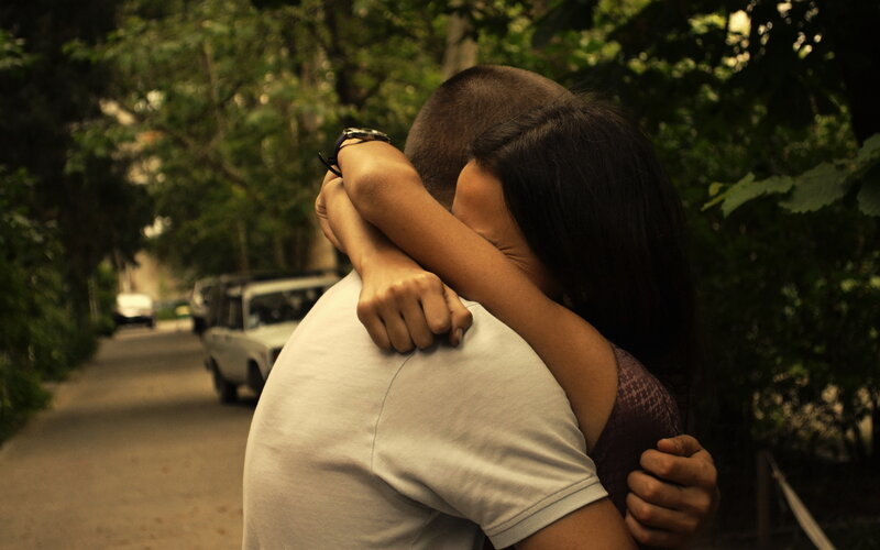 Couple Hugging Outdoors — Green