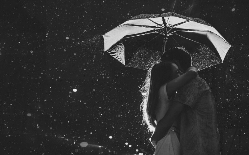 Couple Hugging under Umbrella