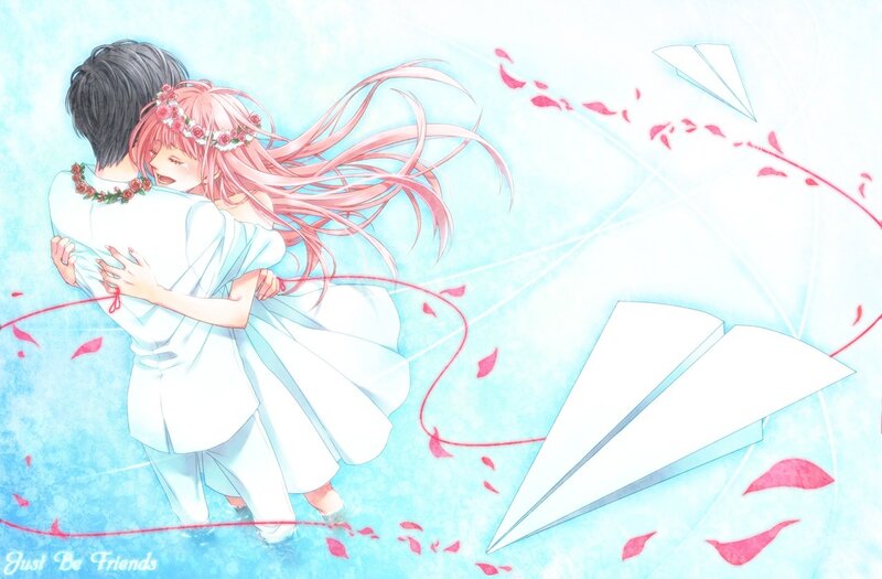 Couple hugging with paper planes