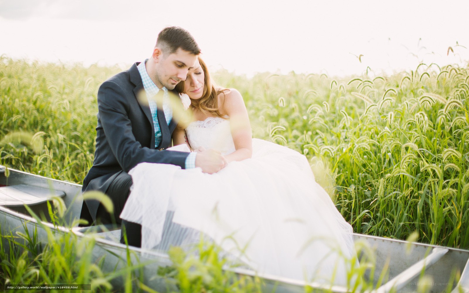 Couple in a boat in a field