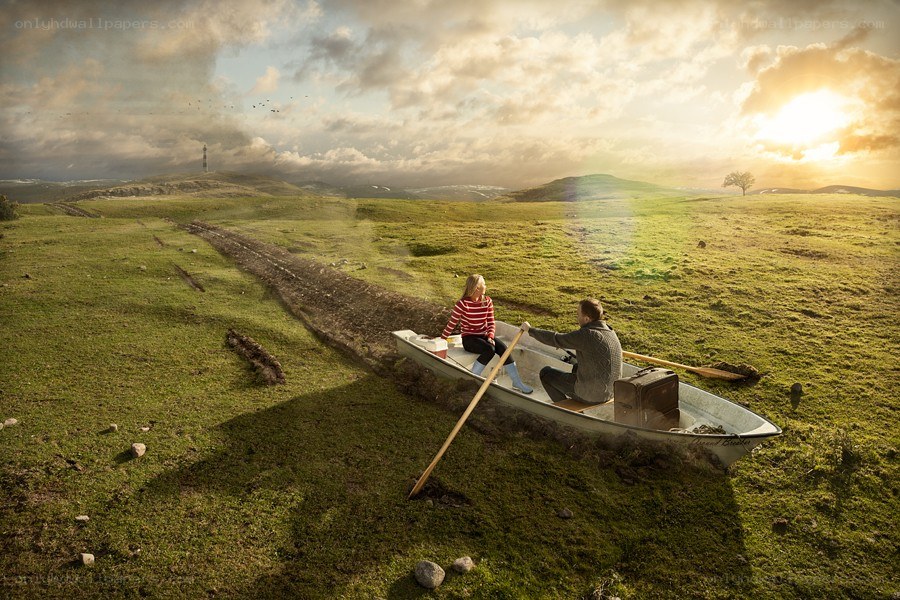 Couple in a boat on grass