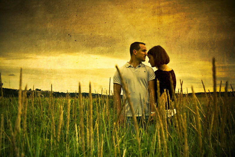 Couple in a field at sunset
