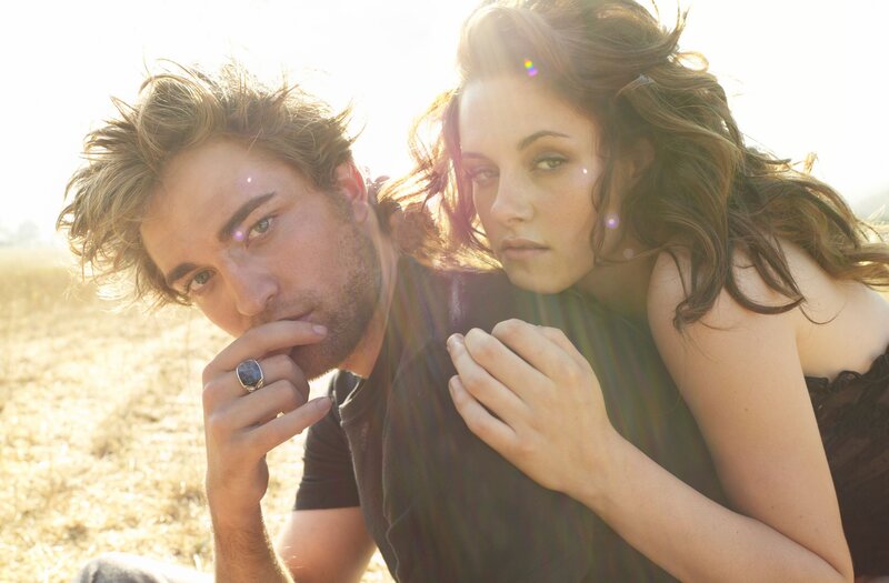 couple in a field at sunset
