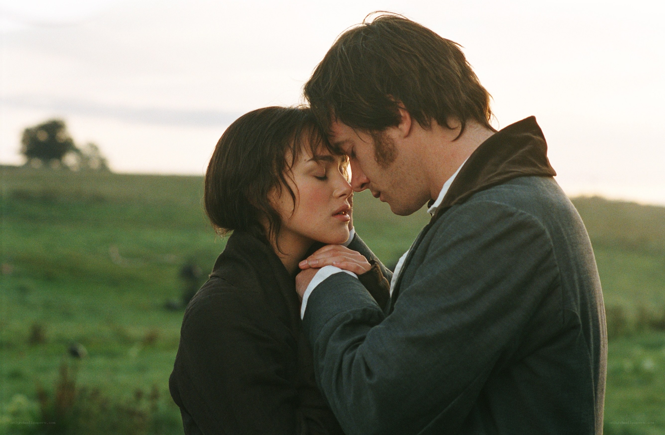 couple in a field embrace