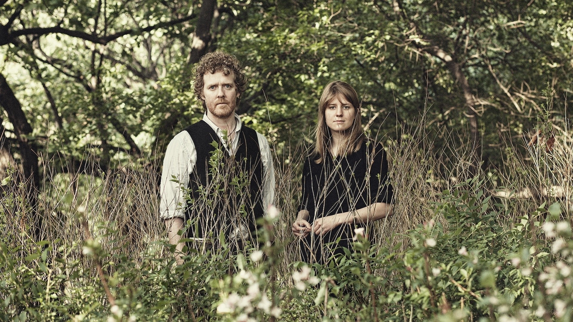Couple in a forest clearing